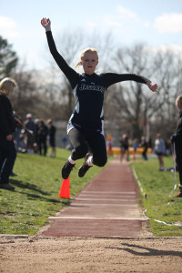 Sophomore Holly Webb competes in the long jump at the Shawnee Mission West Invitational on Friday, April 12.