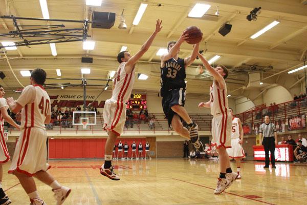 Boys basketball team wins road league game