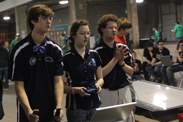 Senior Ryan Hannah and junior Megan Ring practice maneuvering their robot around the practice arena.