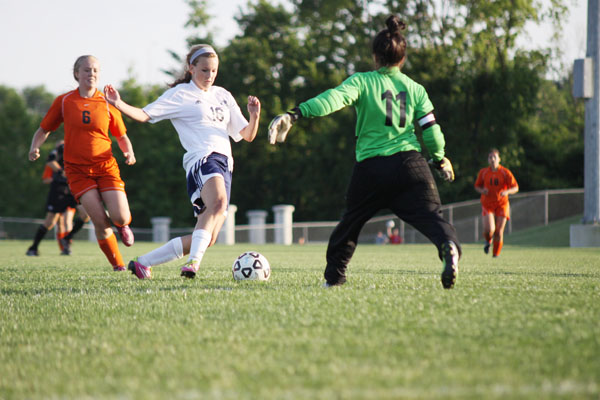 Sophomore Abby Sieperda slips past the Bonner Springs defence on the teams final game on Thursday, May 10. Mill Valley went on to beat the Braves 8-0.