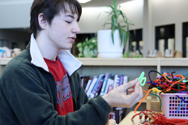 Senior Franklin Reitz creates models using pipe cleaners