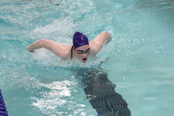 Girls swim at first meet in school history