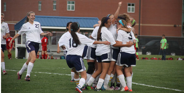 The girls soccer team celebrates their advancement to the state semi-finals at Mill Valley High School on Tuesday, May 21. The girls will play on Friday, May 24 against Valley Center High School in McPherson.