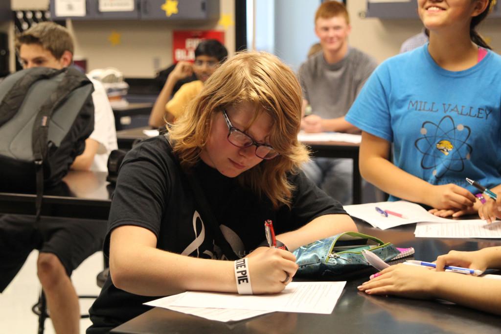 Junior Chari Pierce takes notes in preparation for the upcoming season of Science Olympiad.