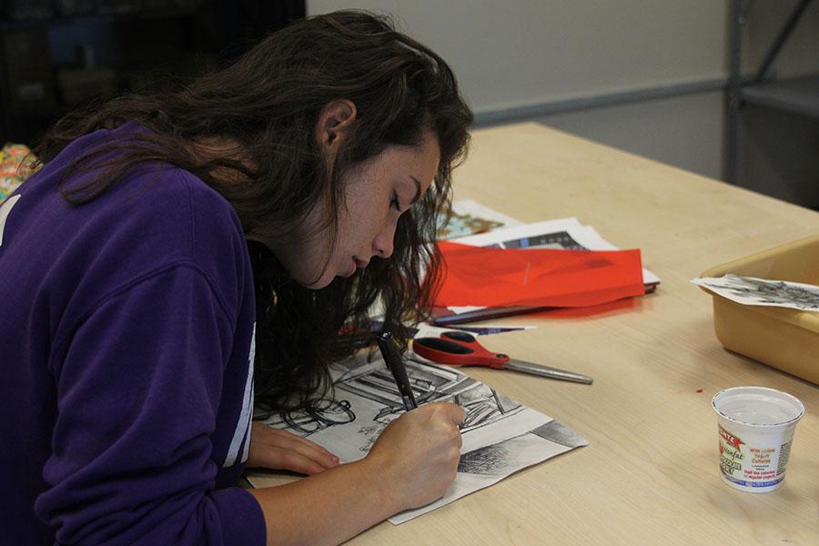 Senior Logan Robertson works on a project in her Silver 4 art class. Robertson sold art work at her aunts art gallery in North Carolina over the summer. 