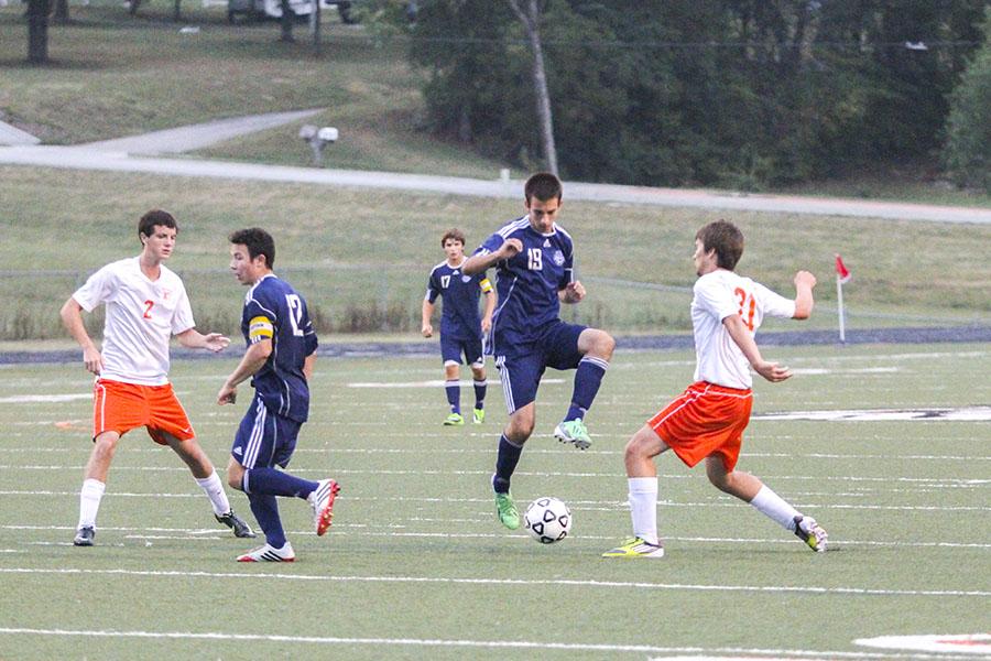 Senior Zach Huston attempts to steal the ball from an opponent in the Sept. 16 soccer game against the Braves at Bonner Springs High School. 