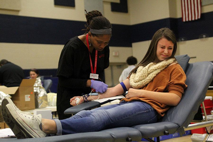 To contribute to the Community Blood Drive on Thursday, Oct. 24, junior Tarah Shane donates for her first time.