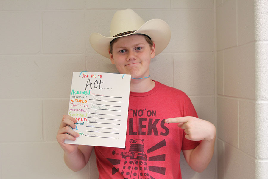 Junior Henry Hanson models his Thespian induction sign on Tues. Oct. 1. 