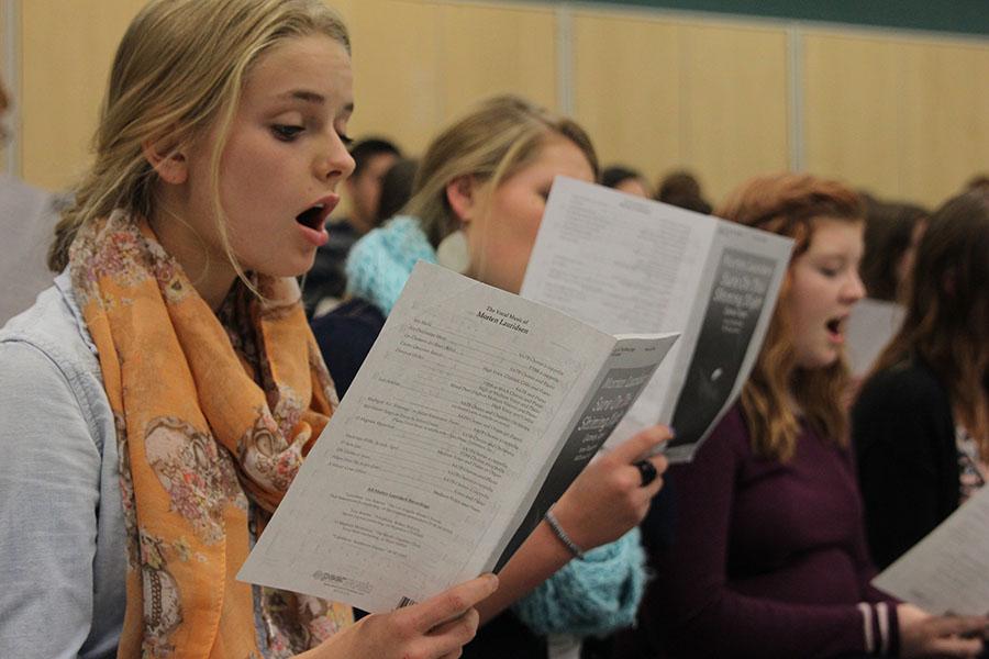 Junior LIbbey DeWitte rehearses Sure on this Shining Night in choir class before Jag Chorales performance at Redemtorist Catholic Church. 