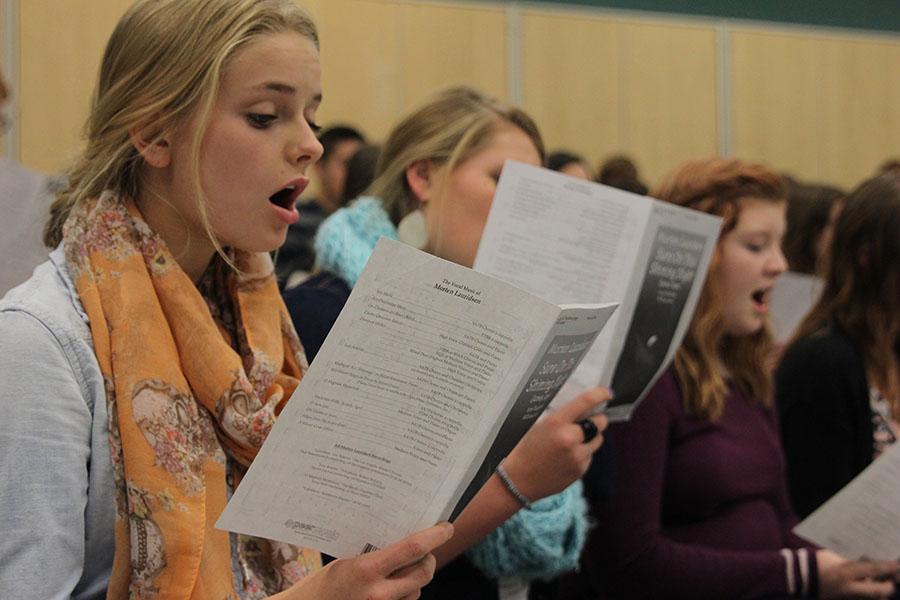 Junior LIbbey DeWitte rehearses "Sure on this Shining Night" in choir class before Jag Chorale's performance at Redemtorist Catholic Church. 