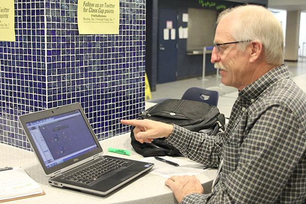Checking the various temperatures throughout the school, energy specialist Dwight Stoppel makes sure the building is free of abnormalities on Tuesday, Dec. 4. “Monitoring is what I do,” Stoppel said. “[I try] to change people’s energy habits.” 