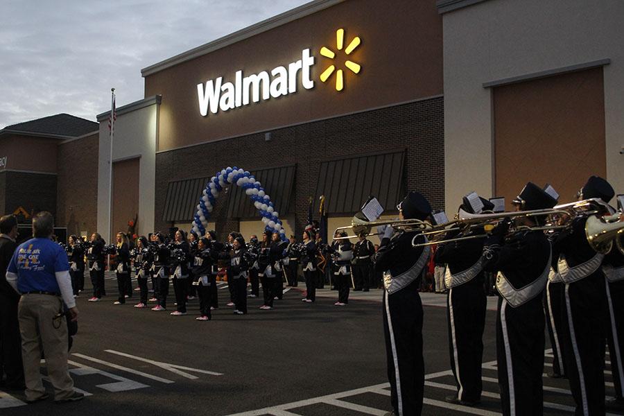 The band and cheerleaders perform at the Wal-Mart grand opening on Wednesday, Oct. 23.