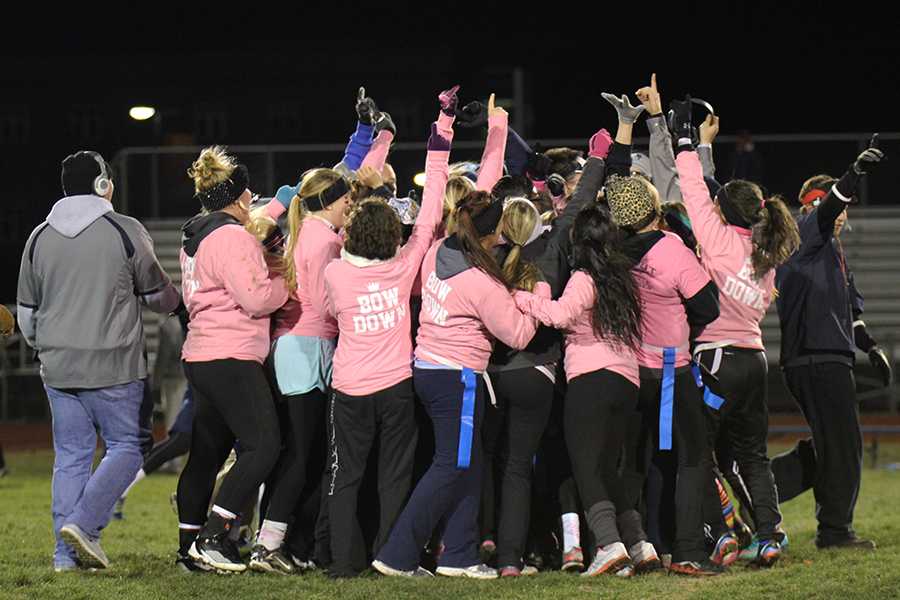 Celebrating their victory, the senior girls cheer after defeating the juniors in the annual Powder Puff game on Nov. 22.