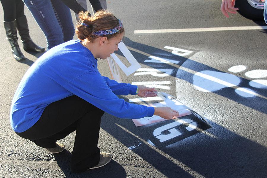 Building improvement committee members of Student Leadership Team finish their new parking spot on Tuesday, Dec. 3.