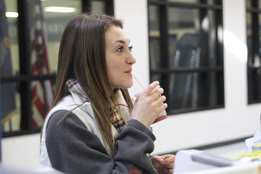 After buying her first Jamba Juice smoothie on Tuesday, Dec. 10, senior Olivia Phillips is pleased by the taste. 