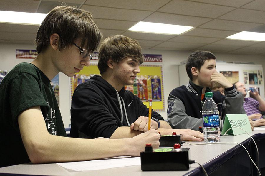 Sophomore Patrick Gambill works through a math problem at the varsity Scholars Bowl meet at Maranatha Christian Academy on Thursday, Jan. 23. 