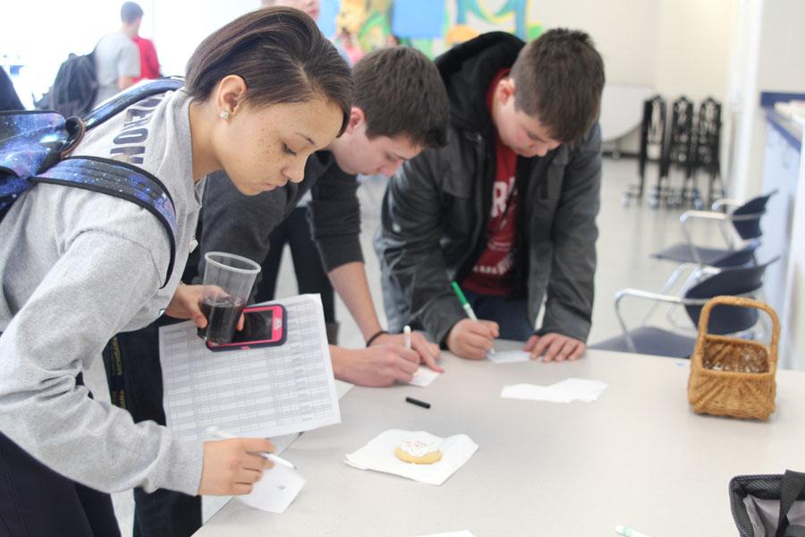 Filling out the answer to a trivia question, freshman Kameron Smith takes a break from seminar to enjoy the jagPride-sponsored National Drug Fact Awareness Week on Jan. 29.