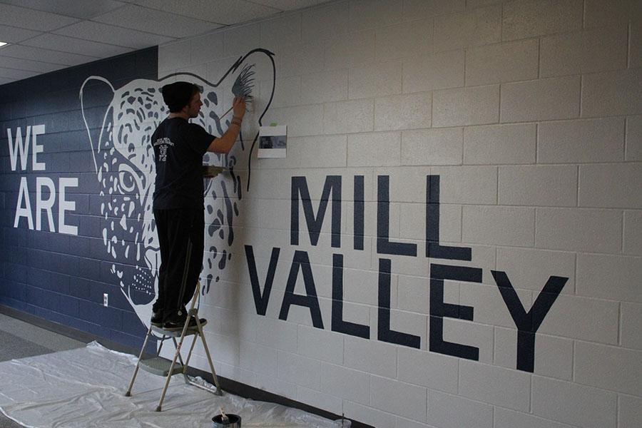 NAHS vice president Steven Blaine puts a few finishing touches on the new mural in the C-wing on Thursday, Jan. 16. “The actual painting was hard, but when you finish it, it all just makes it worth while,” Blaine said.