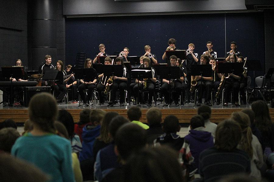 Playing in front of young, attentive listeners at Horizon Elementary School, the Jazz Band performs to help the children learn about jazz music. 