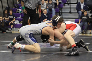 Wrestling team places first at league tournament