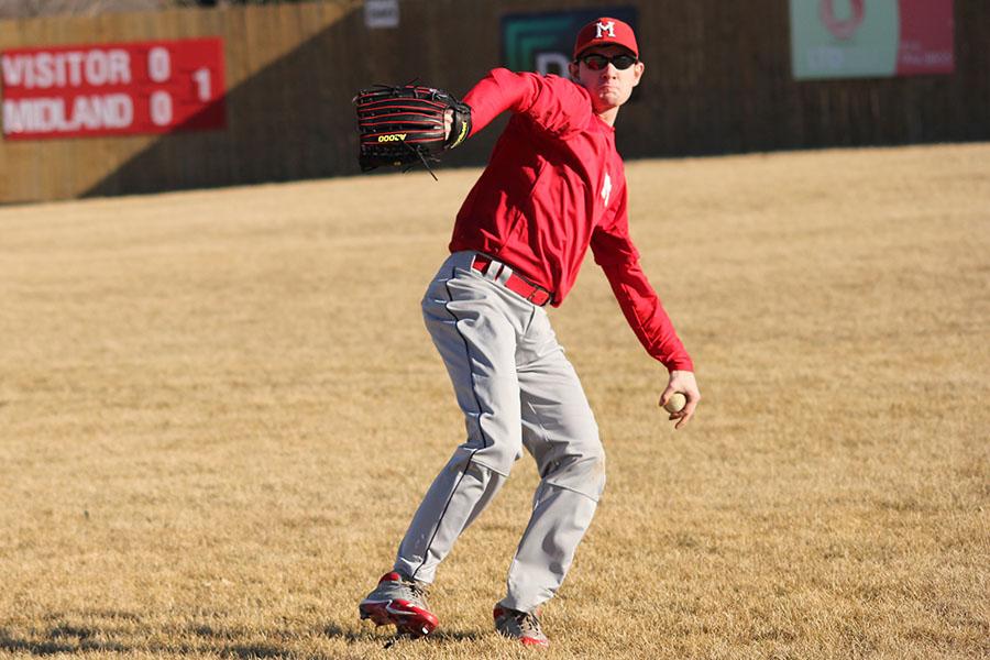 In a relay drill, senior Drew Novak throws the ball to his teammate during practice on Sunday, March 9. Playing baseball left-handed is really difficult when you first start out, Novak said. You really have to be willing to put in a little extra work in order to catch up to the right-handed kids and figure things out for yourself.