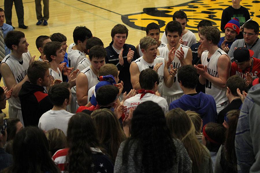 Members of the basketball team celebrate their 67-53 win over Topeka Seaman in the first round of the sub-state tournament on Wednesday, March 5. The team will play at Lansing on Friday, March 7 for the sub-state championship.