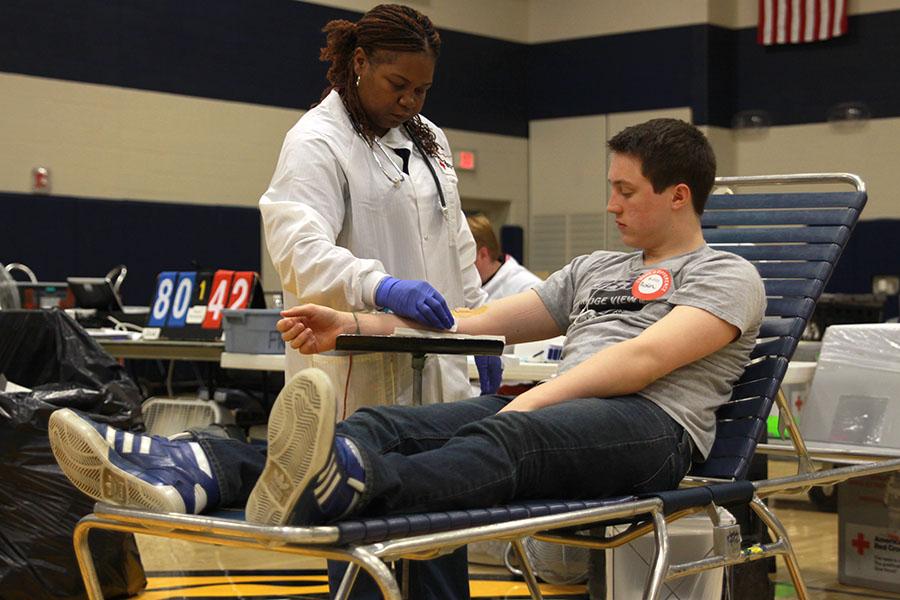 Following his blood donation, junior Austin Isern is sanitized and bandaged.