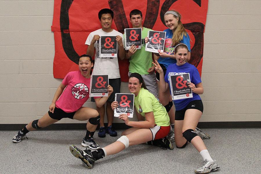 The winners of the Kick Butts Day tournament pose in front of a banner on Wednesday, March 26. CVS pharmacy recently decided to stop selling tobacco products.