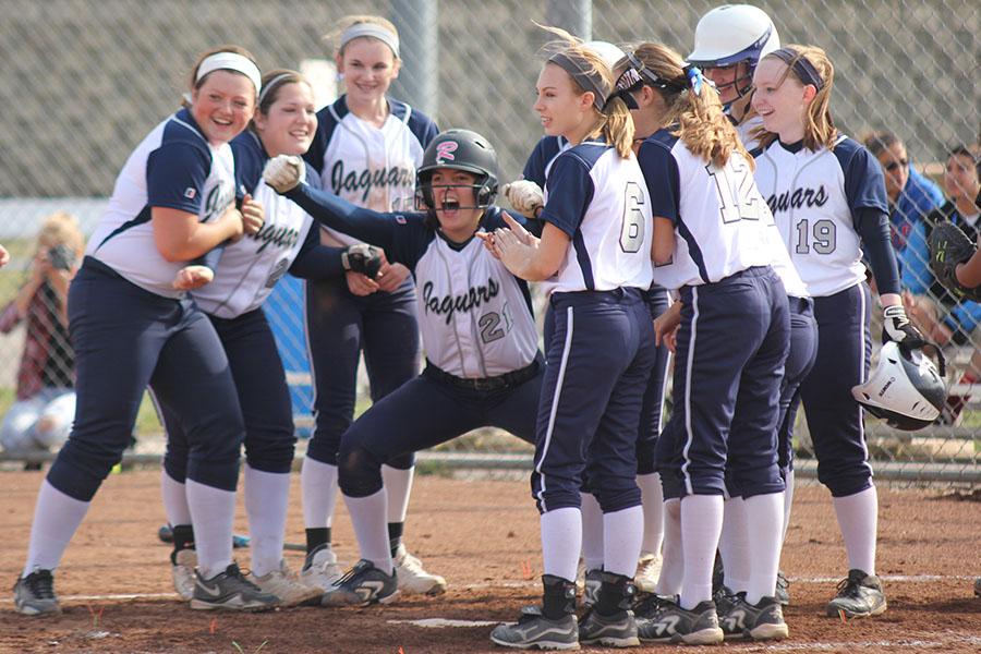 The softball team defeats Bishop Ward 17-0 and 15-0 to start the season 2-0 on Thursday, April 3.