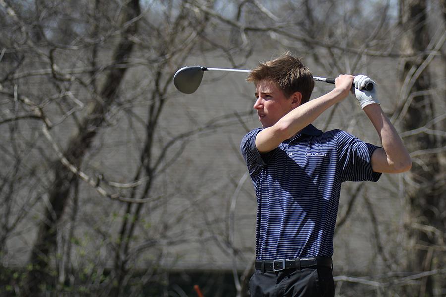 After a swing, junior Jack Casburn watches for his ball at the Jaguar Invitational golf tournament on Wednesday, April 9. 