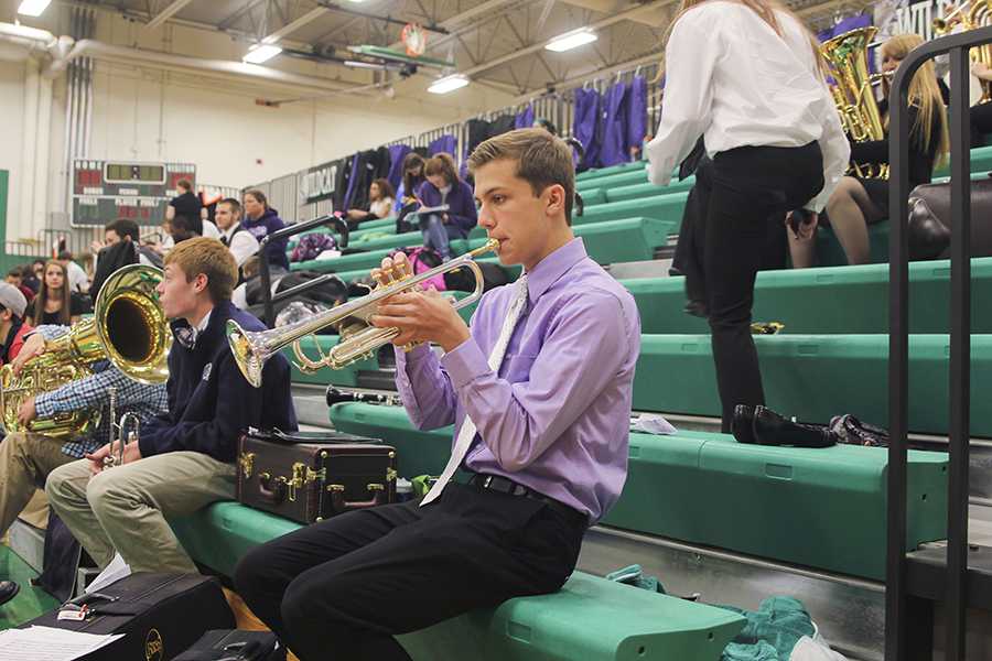 Junior Eric Marquardt prepares for his solo at the KSHSAA Music Festival in the auxilliary gym of De Soto High School on Saturday, April 5. 