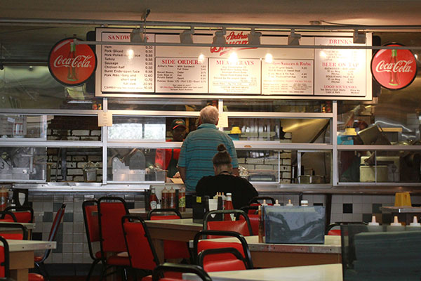 A man orders from behind the large windows at the original Arthur Bryant’s in Kansas City, Mo. on Thursday, April 10. Arthur Bryant’s was founded in 1908 and has been visited by several former presidents and celebrities, making it one of Kansas City’s most storied barbecue joints.