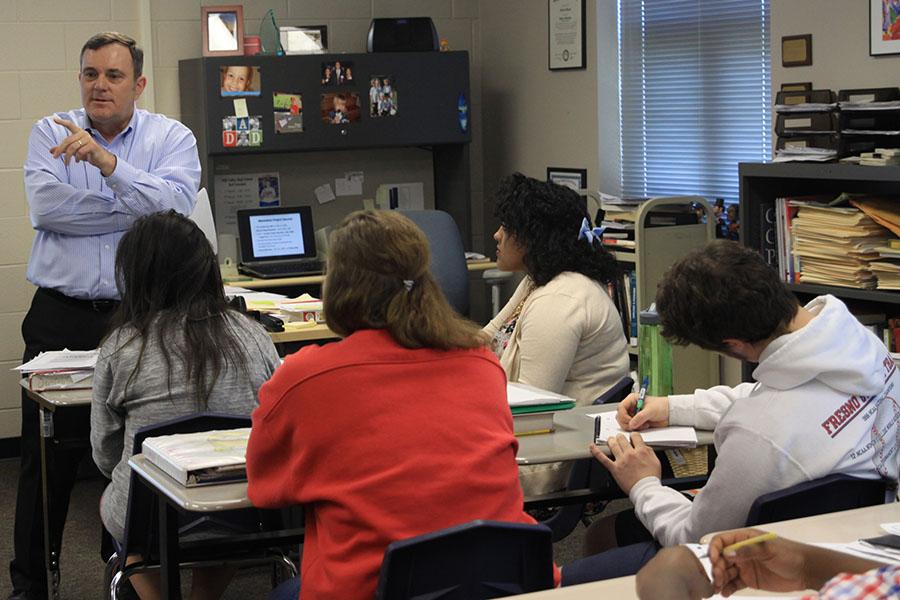 Student teacher Phillip Warring explains the expectations of an upcoming debate on the Hiroshima bombing in AP U.S. History. 