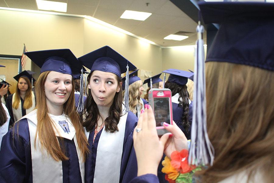 At graduation on Saturday, May 17, seniors Katie Linsey and Becca Bilyeu pose for a photo. 