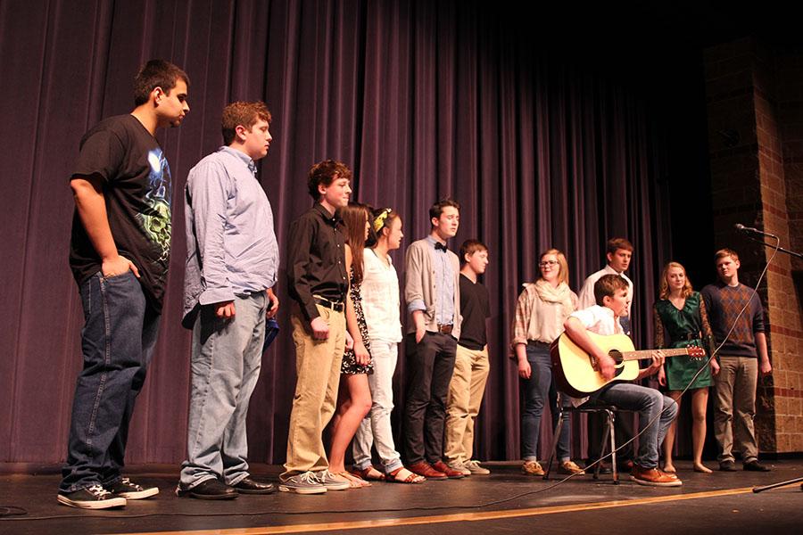 As part of the finale, talent show participants gather around freshman Sam Lopez and sing. Im  pretty happy with how it went. I felt pretty good, Weinert said. Its always fun to perform for people, its exciting. 