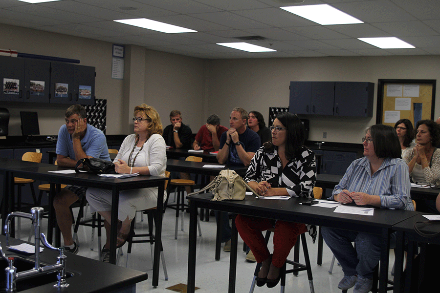 Parents listen to science teacher Alyssa Meyers presentation on Thursday, Aug. 28 at Back to School Night.