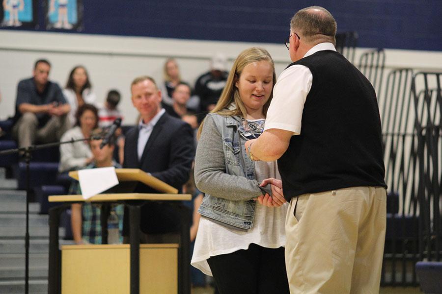 While in attendance at the Academic Ceremony, junior Kristen Alderson accepts her acadamic letter on Wednesday, Sept. 10.  