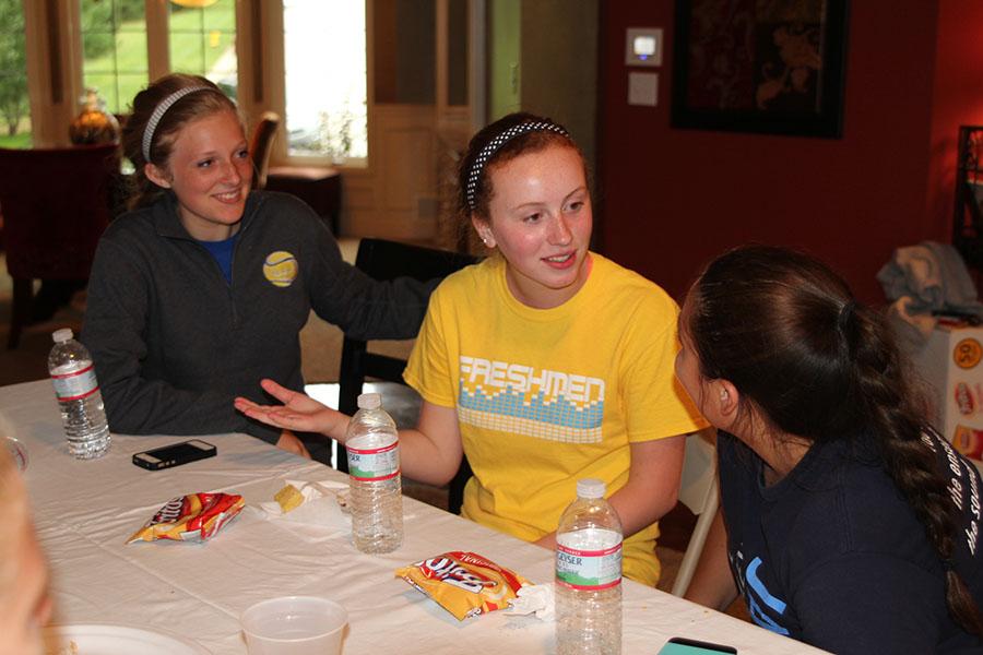 After practice, the Girls Tennis Team gathers at junior Shelby Hudsons home to eat dinner on Thursday, Sept. 11.