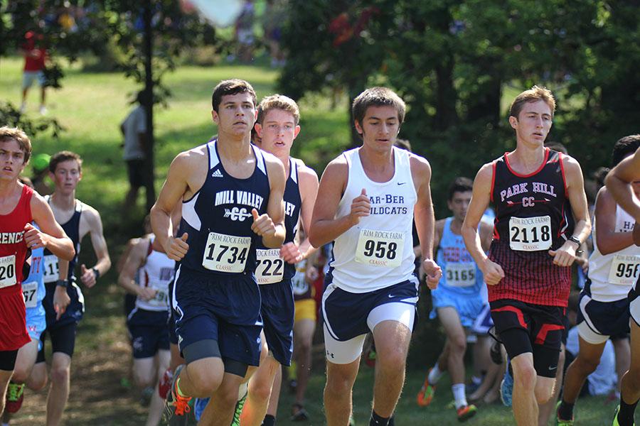 While running uphill at Rim Rock Farm on Saturday, Sept. 27, junior Derek Meeks focuses on finishing the course . Meeks placed 19 among 305 other runners. 