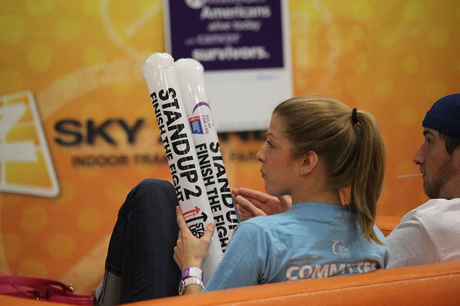 A spectator listens to guest speaker Paul Coffman at the Stand Up To Cancer event at Sky Zone Indoor Trampoline Park on Friday, Sept. 5. 