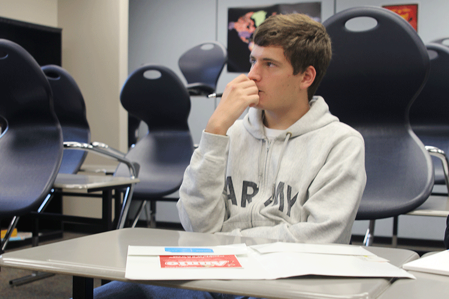 Senior Kyle Foley intently listens to what Literary Magazine sponsor Anna Nelson has to say on Thursday, Sept. 18. Im excited to have a better literary magazine, Foley said.