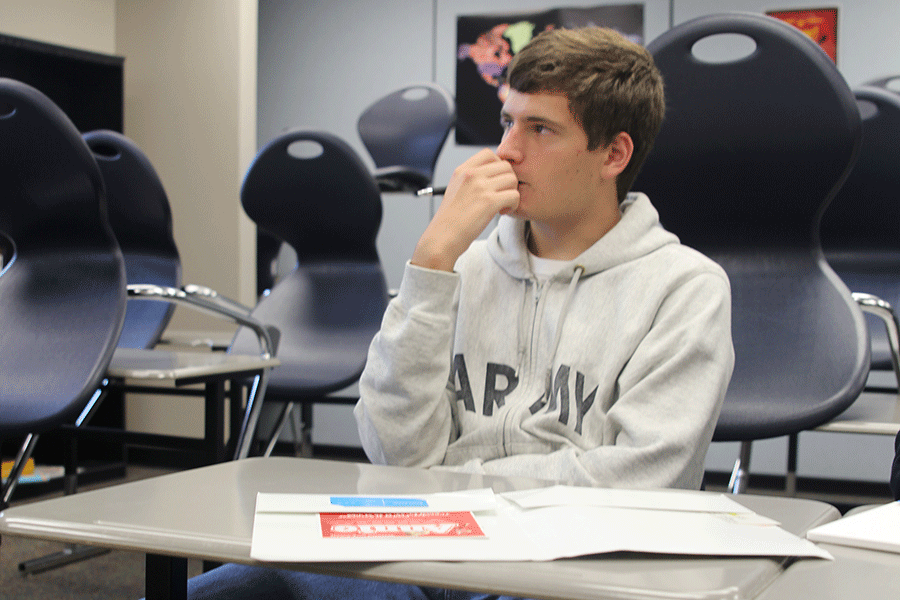Senior Kyle Foley intently listens to what Literary Magazine sponsor Anna Nelson has to say on Thursday, Sept. 18. "I'm excited to have a better literary magazine," Foley said.