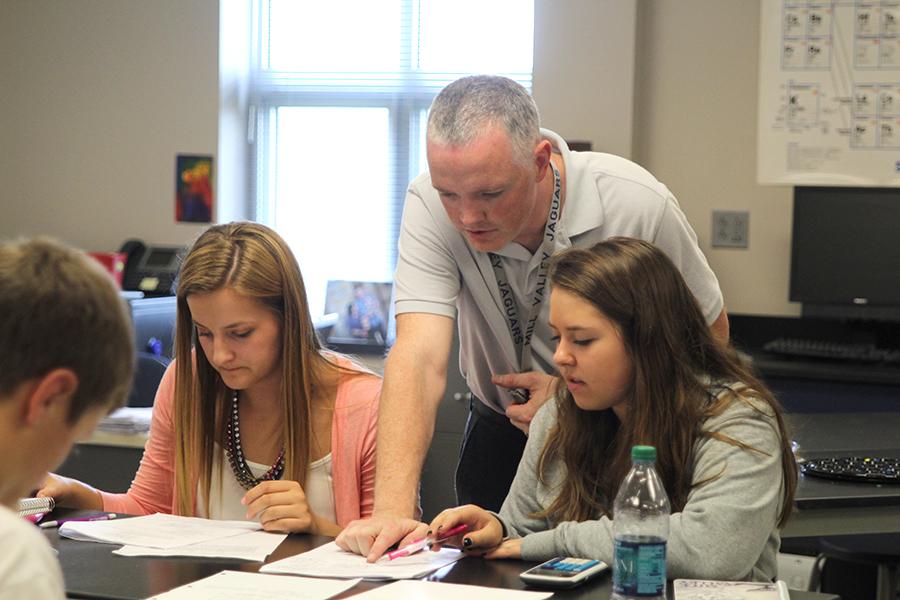 First year science teacher Chad Brown helps his students in Physics. 