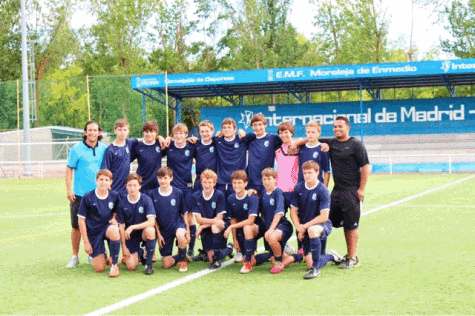 Boys play soccer in Spain during summer