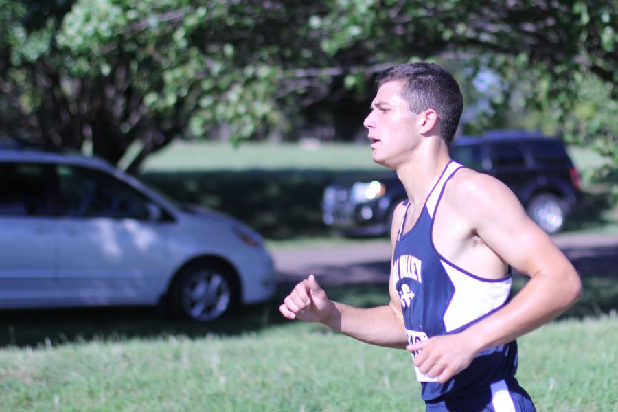 Junior Derek Meeks runs the course at Shawnee Mission Park in the Shawnee Mission South Invitational on Thursday, Sept. 4. Meeks placed first overall out of 149 male runners. 