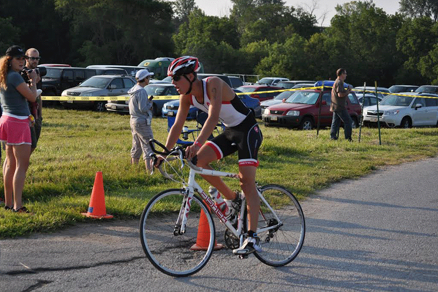 As he approaches the transition area of the Omaha, Nebraska triathlon this past July, Eckardt prepares to dismount his bike and throw on his running shoes.