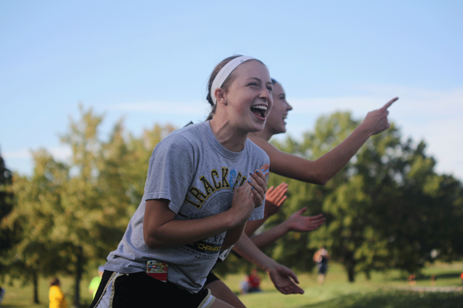 At the league Cross Country meet on Thursday, Oct. 16, junior Ellie Wilson cheers on her friends. 