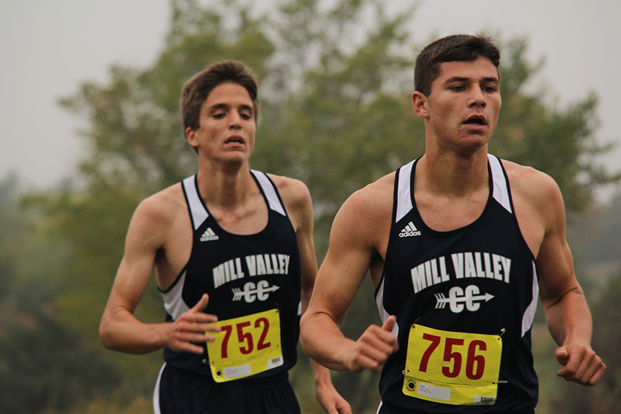 At the Cat Classic on Thursday, Oct. 9, senior Kurt Loevenstein and junior Derek Meeks run in sync. The girls team placed third and the boys team placed second.