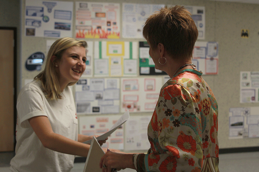 Catty Shack and DECA Vice President of Finance senior Kylie Tennis rehearses her introduction on Wednesday, Oct. 22 for the upcoming competition. 