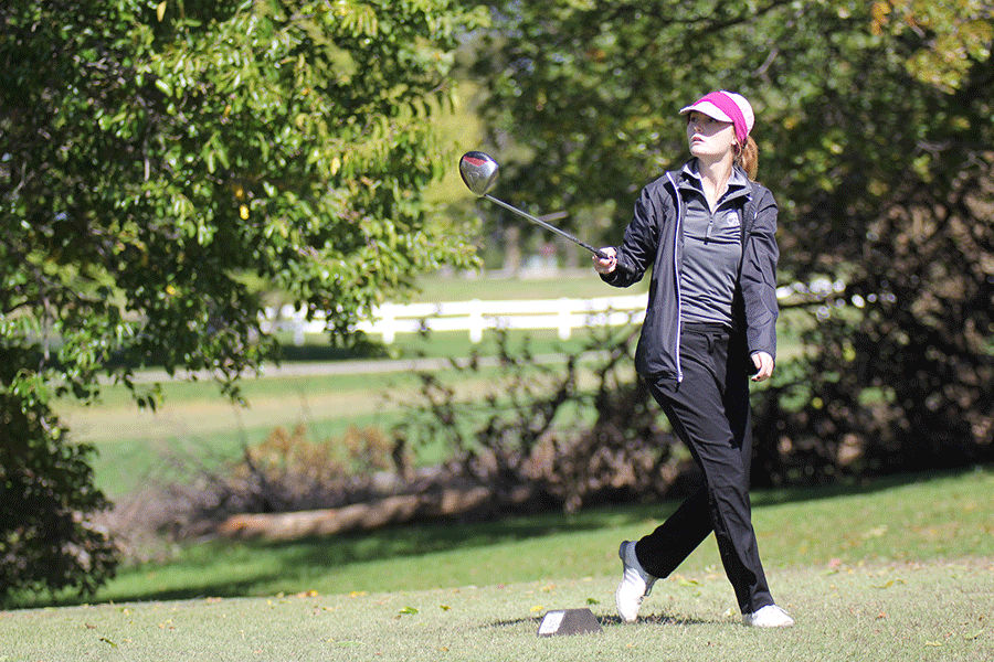 Sophomore Grace Van Inwegen follows through as she hits the ball on Tuesday, Oct. 14.